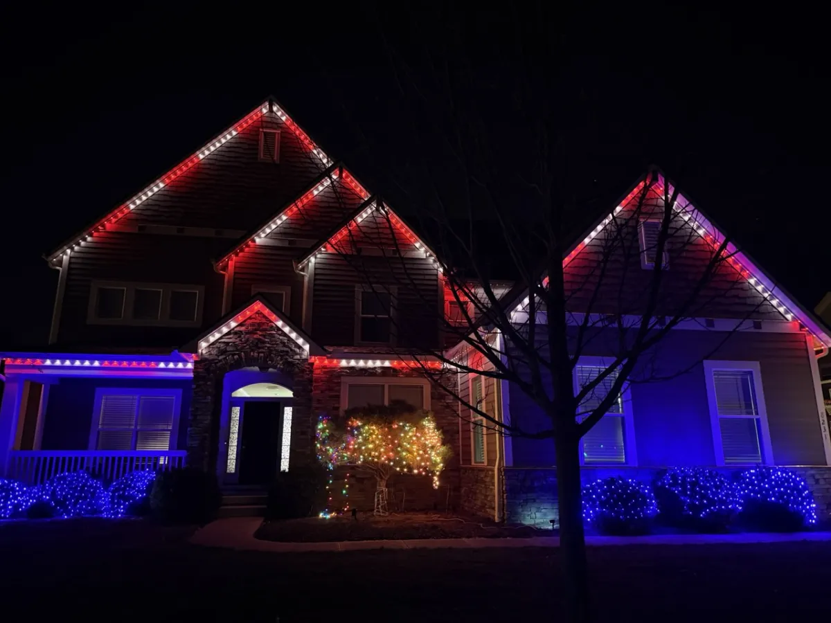 Red white and blue permanent lights on craftsman home for 4th of July