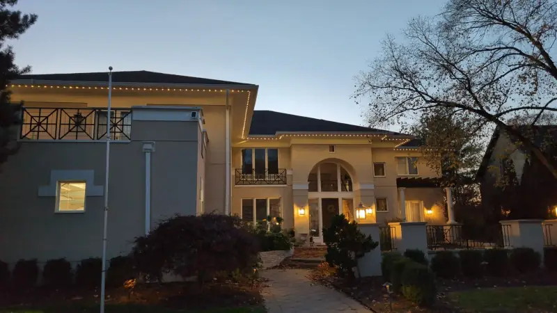 Permanent warm white accent lights on elegant mansion in Columbus Ohio